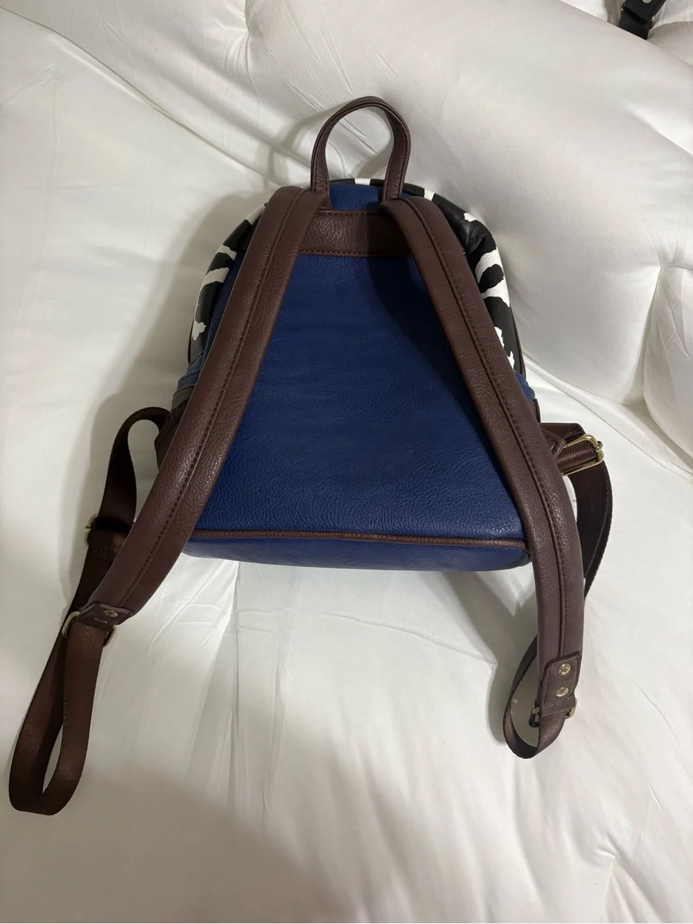 Loungefly Woody-Inspired Mini Backpack in Blue, Yellow, Brown, White, Black